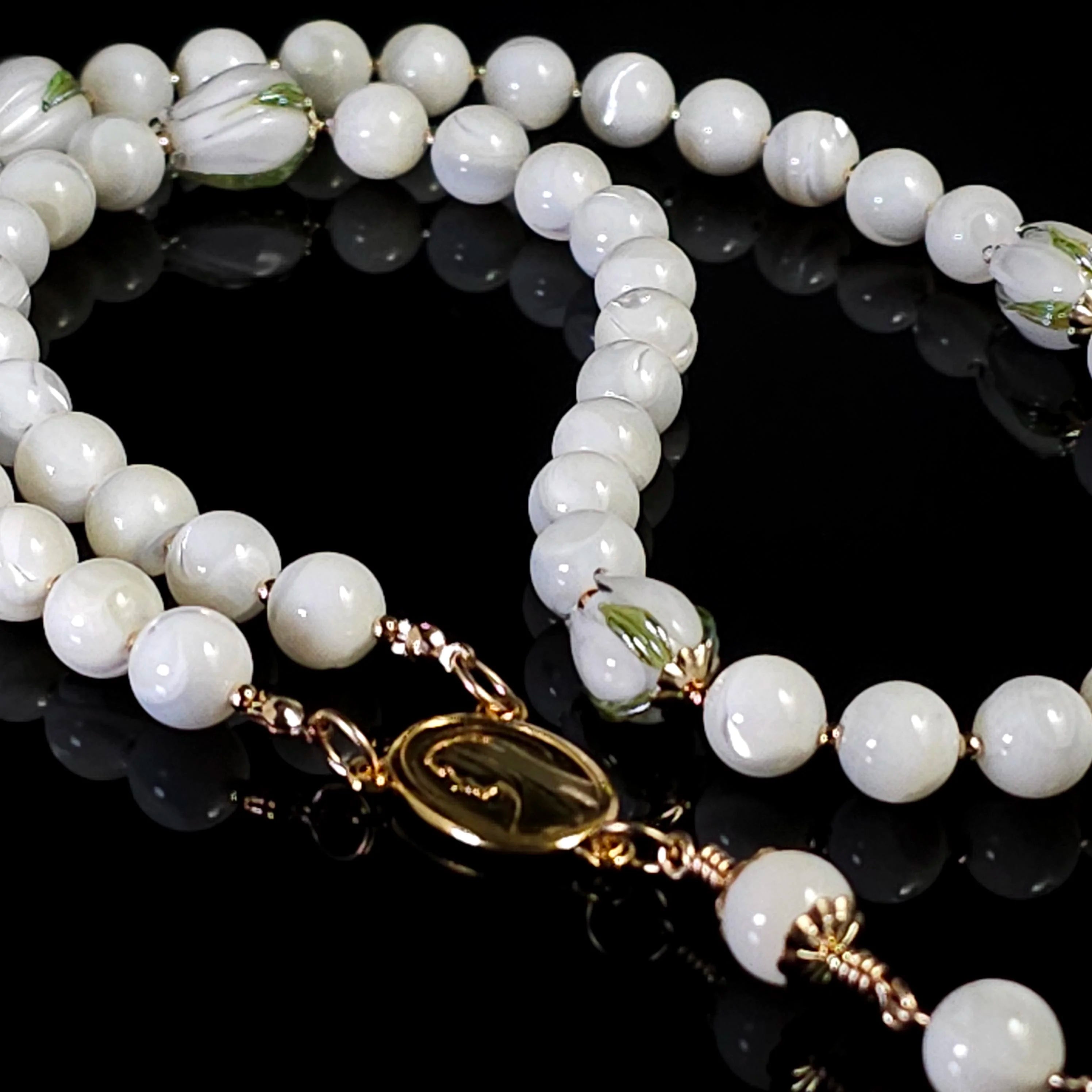 Easter white tulip rosary on table top.