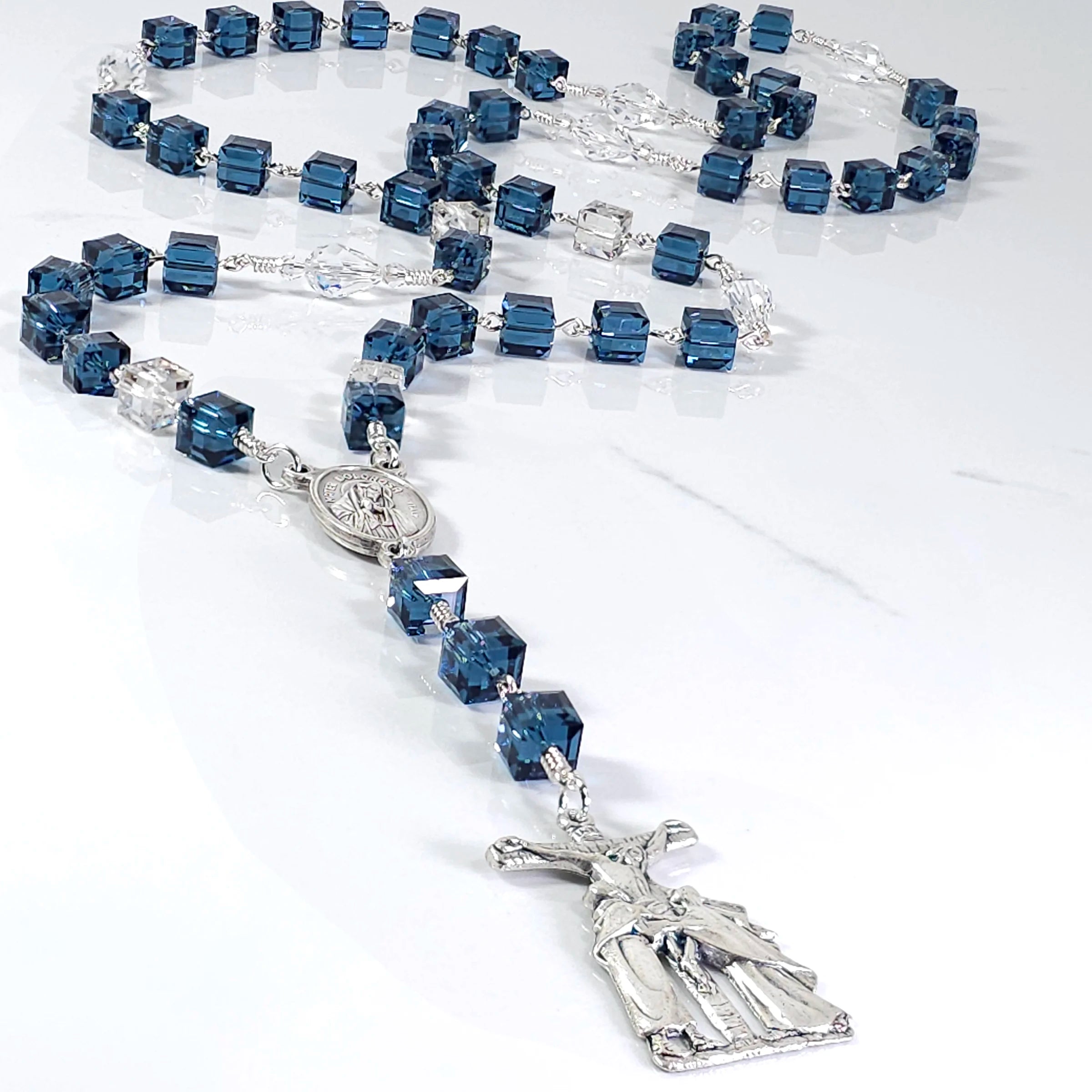 Our Lady of Sorrows rosary made with blue Swarovski crystals, embodying deep spiritual significance