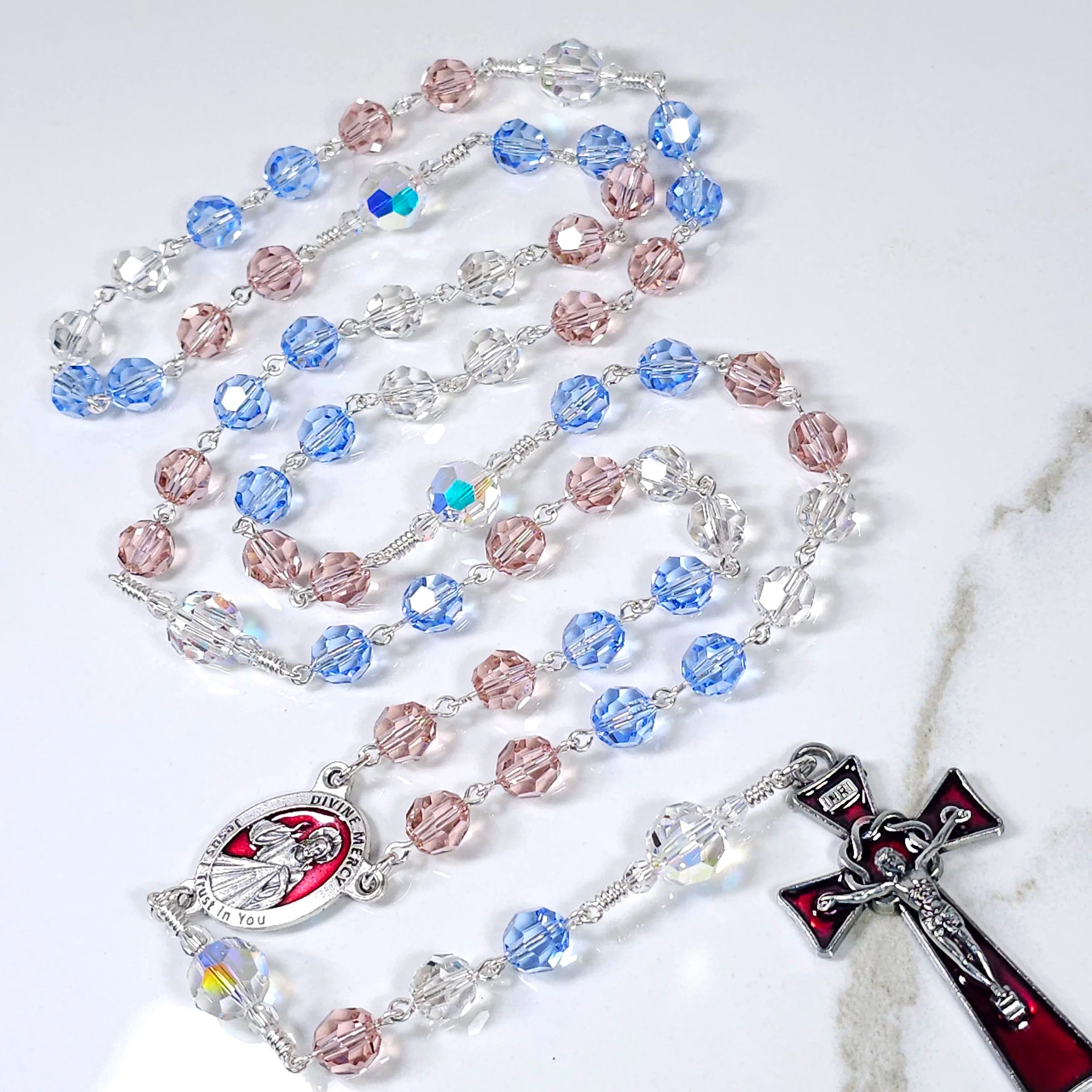 The red and white rays in the Divine Mercy image symbolizing blood and water.