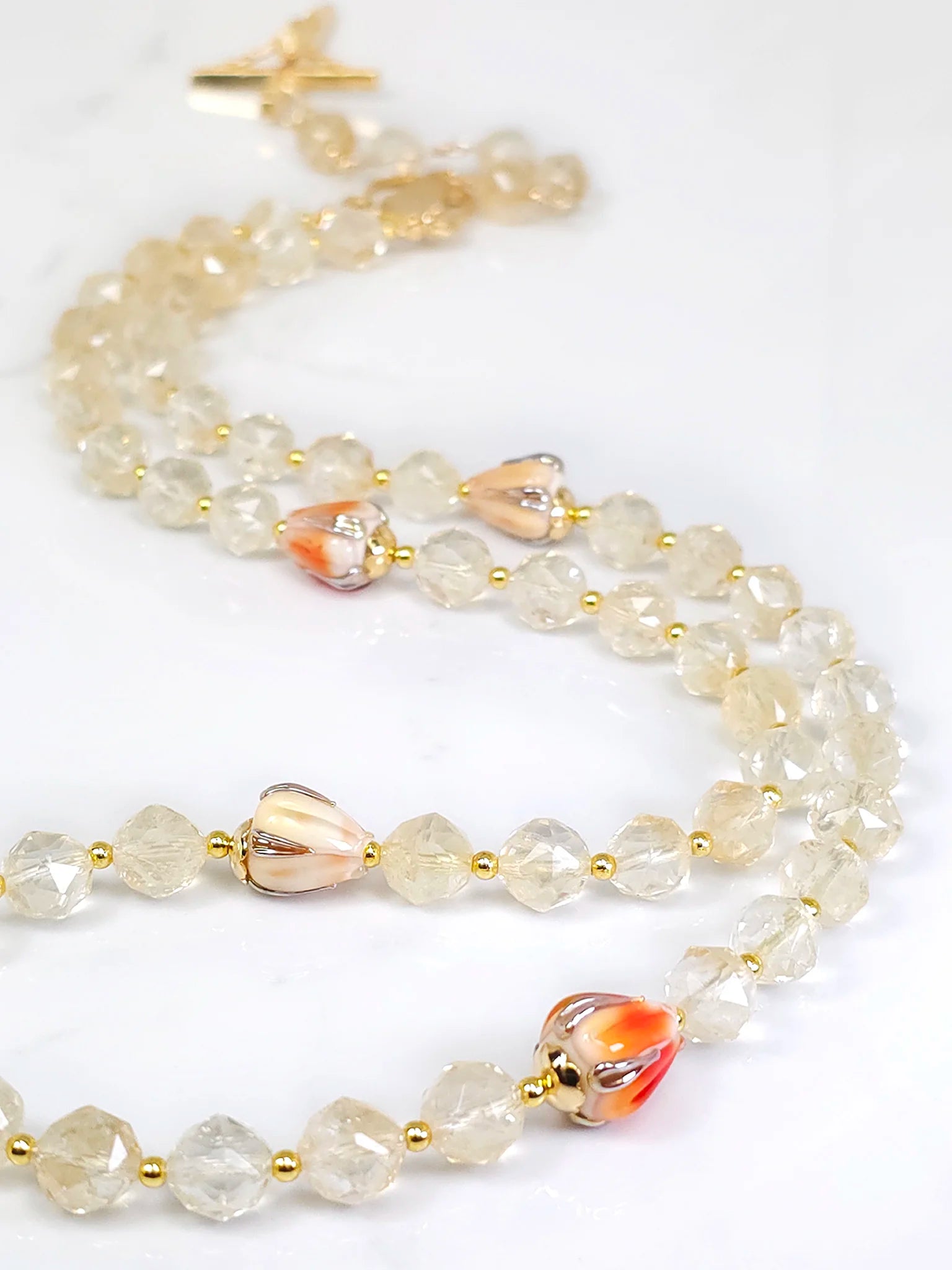 Golden Citrine Rosary with Glass Flower Beads, featuring 8 mm Natural Golden Citrine beads, displayed elegantly.