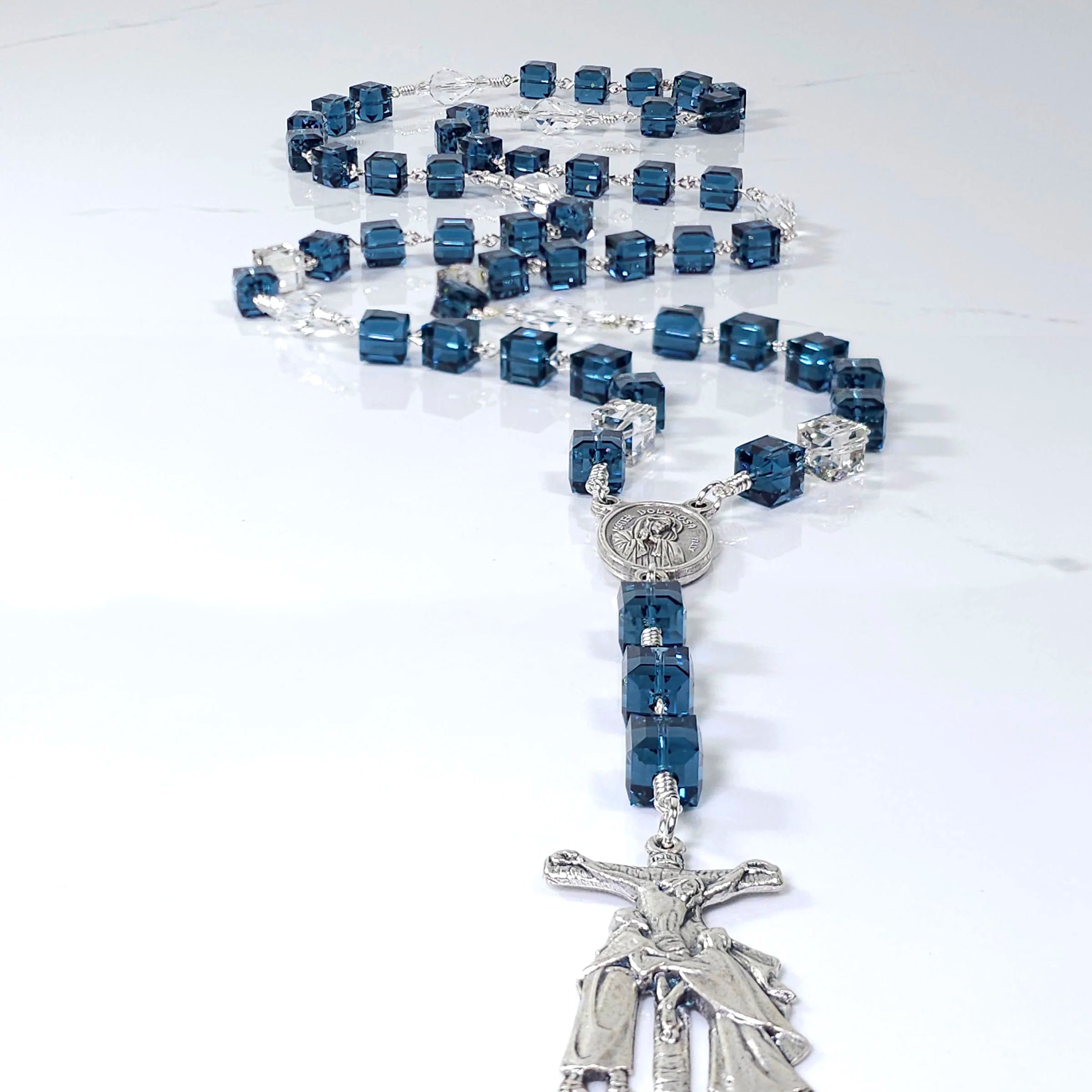 Devotional rosary featuring blue Swarovski crystals, inspired by the grief of the Blessed Virgin Mary