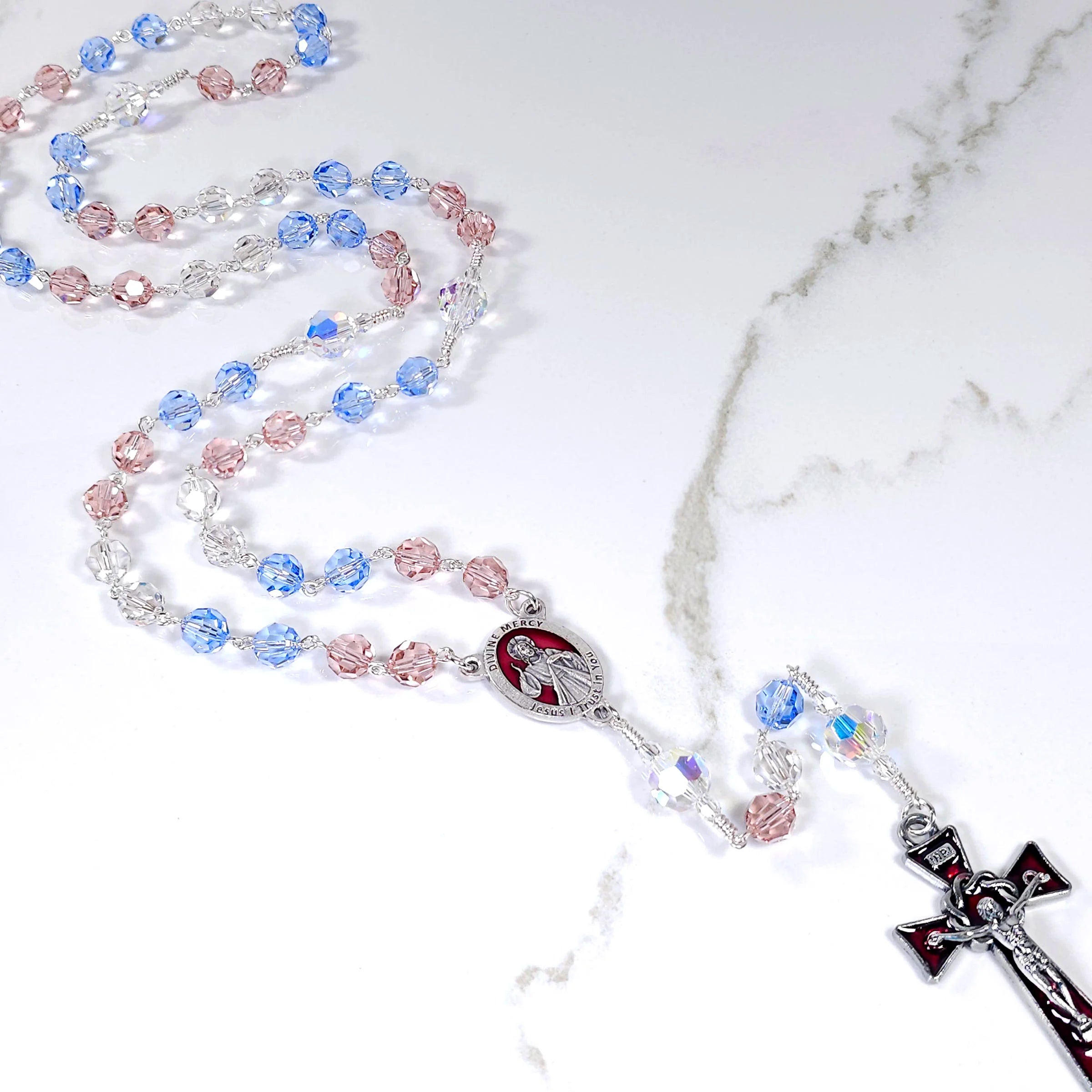 The Divine Mercy image with rays of red and white light, as seen by Saint Faustina.