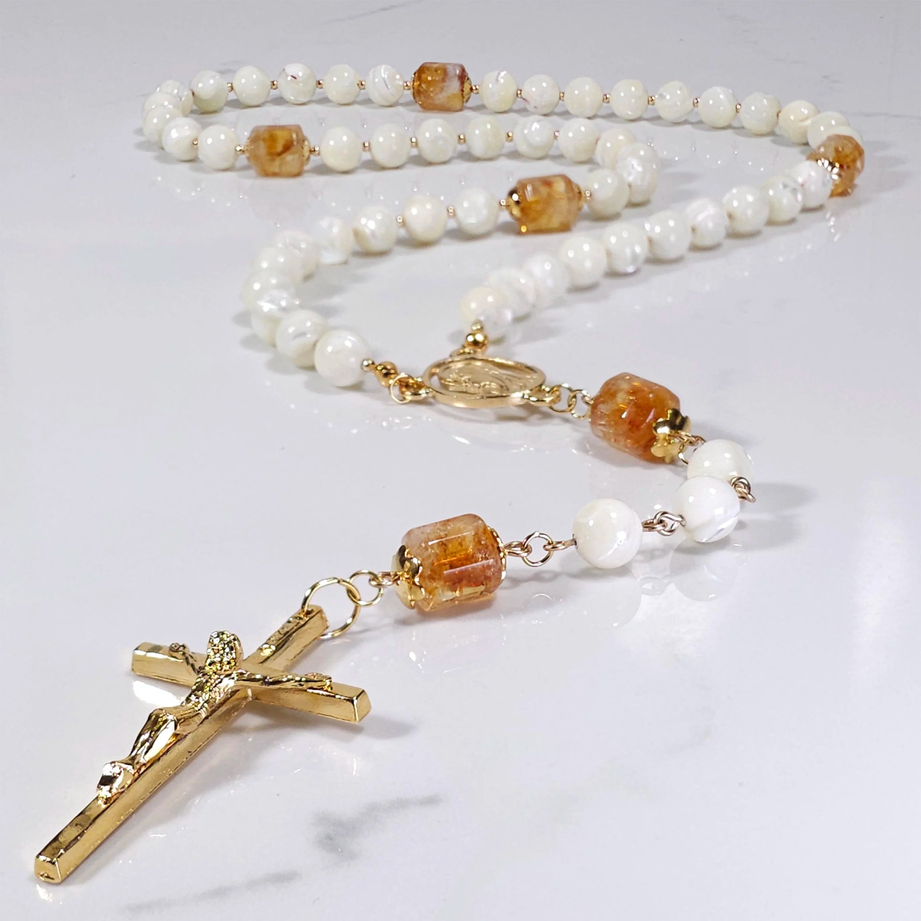 Stella Maris rosary laying on the table.