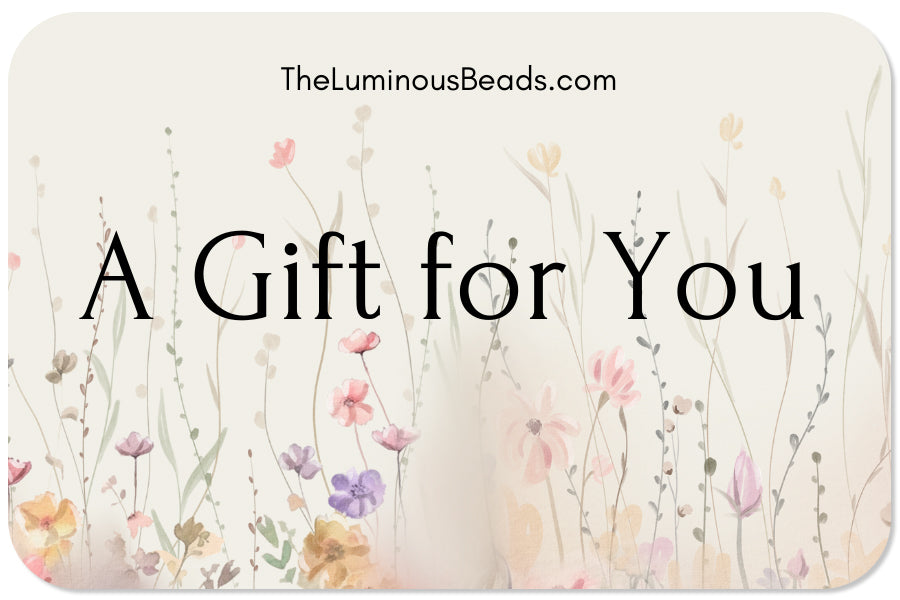 The Luminous Beads Gift card with soft color flowery design and the Luminous Beads name.