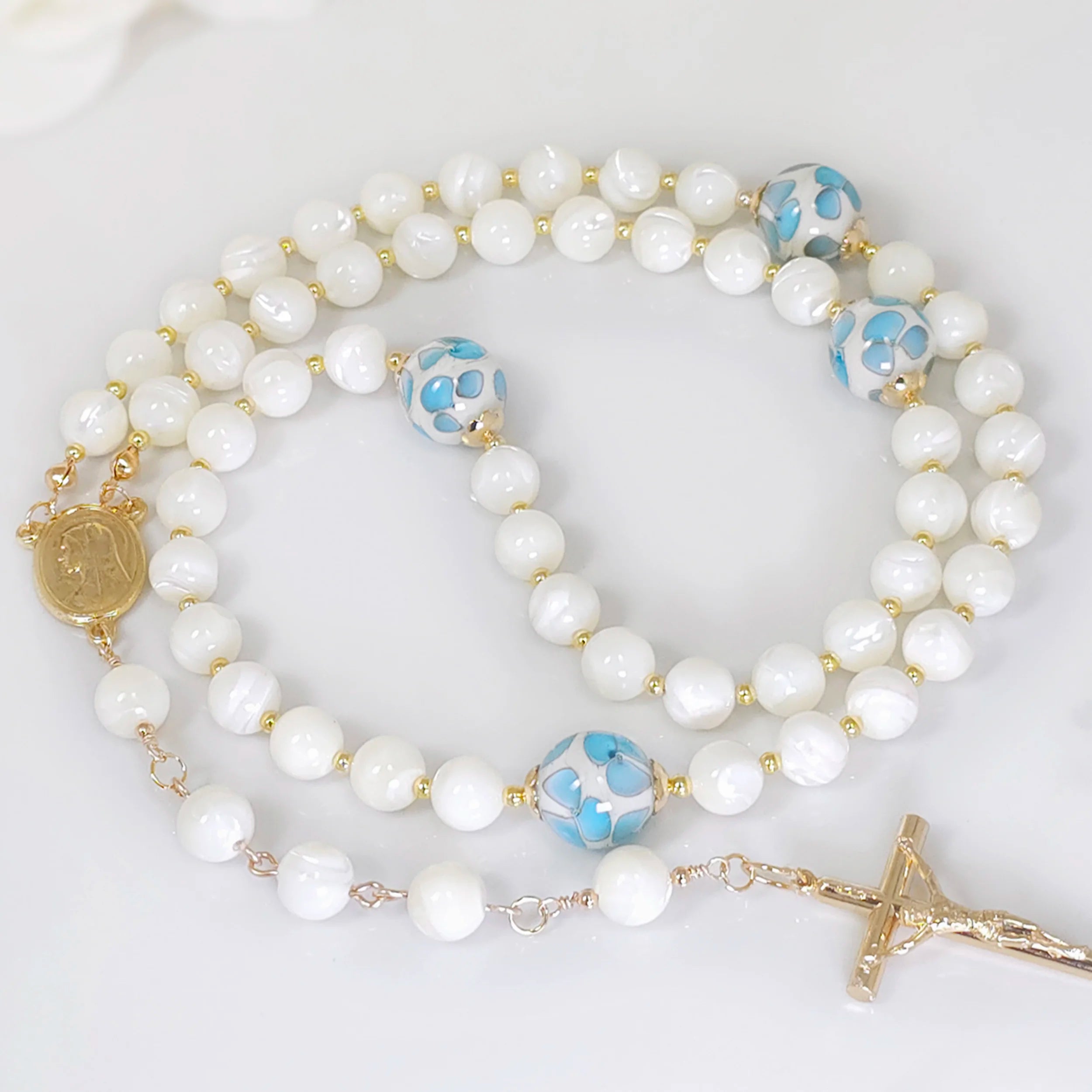 Little Blue Flower and Pearl Rosary Necklace with White Mother of Pearl, complemented by gold-filled spacers and bead caps.