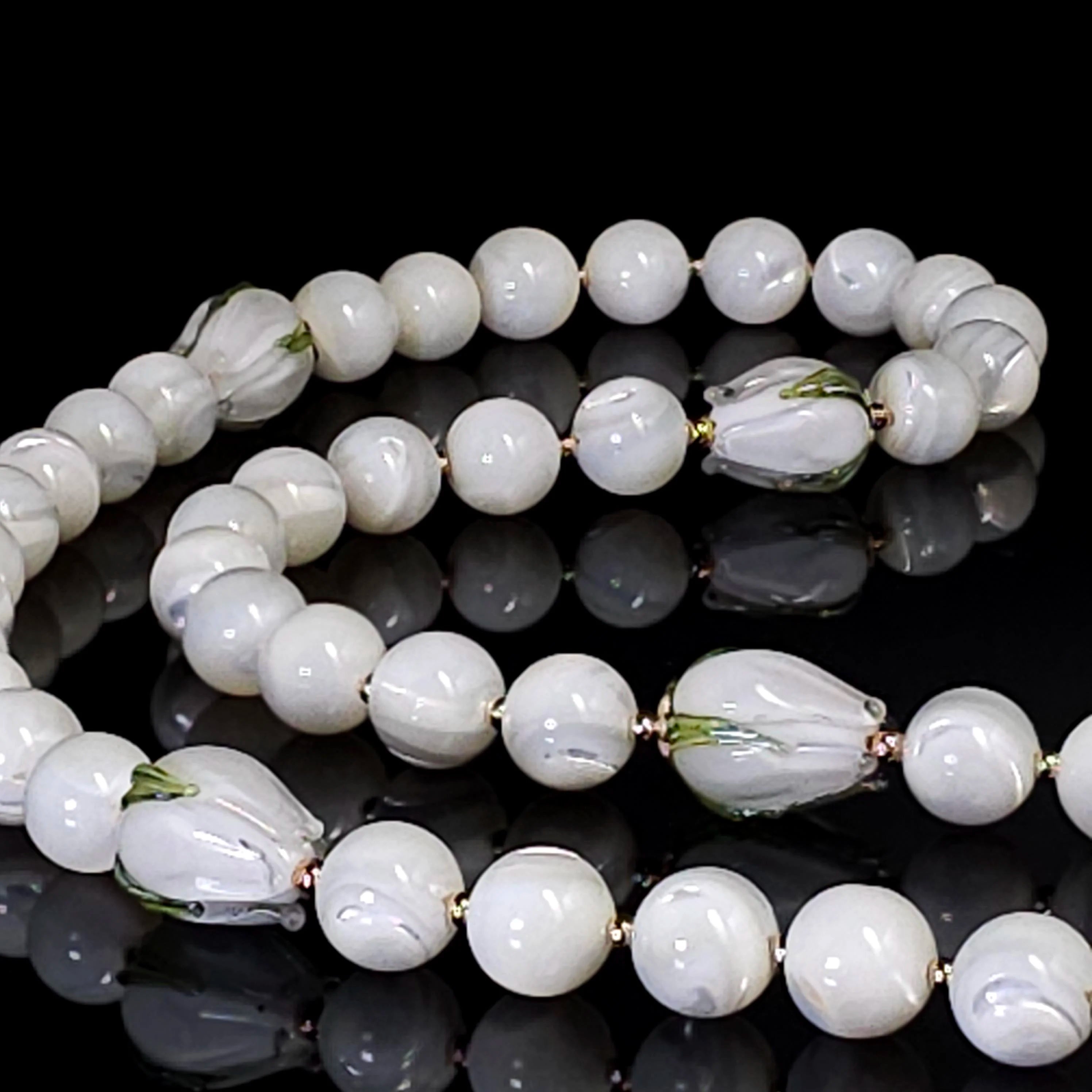 White tulip easter rosary made from mother of pearl beads.