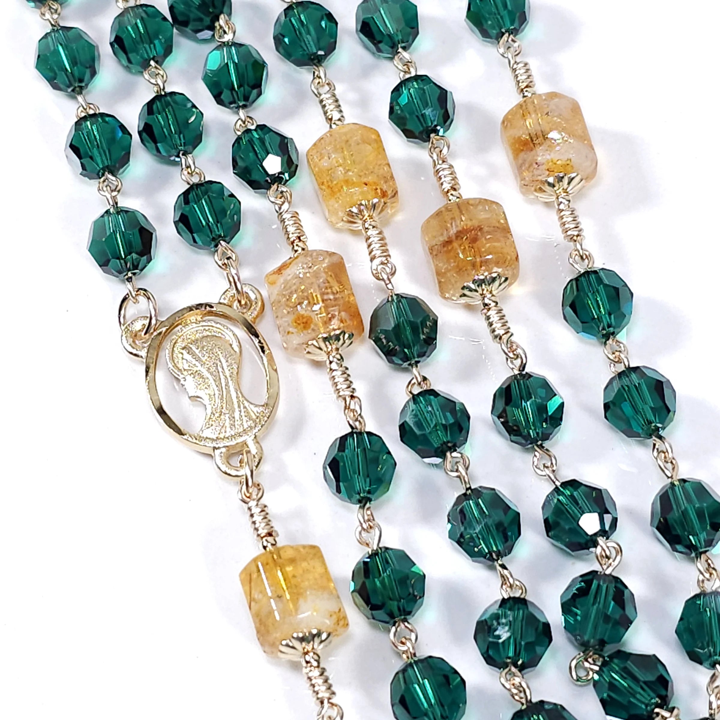 very beautiful green and gold lady of Guadalupe rosary.