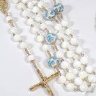 beautiful little blue flower and white pearl rosary perfect for our lady of Lourdes devotion.