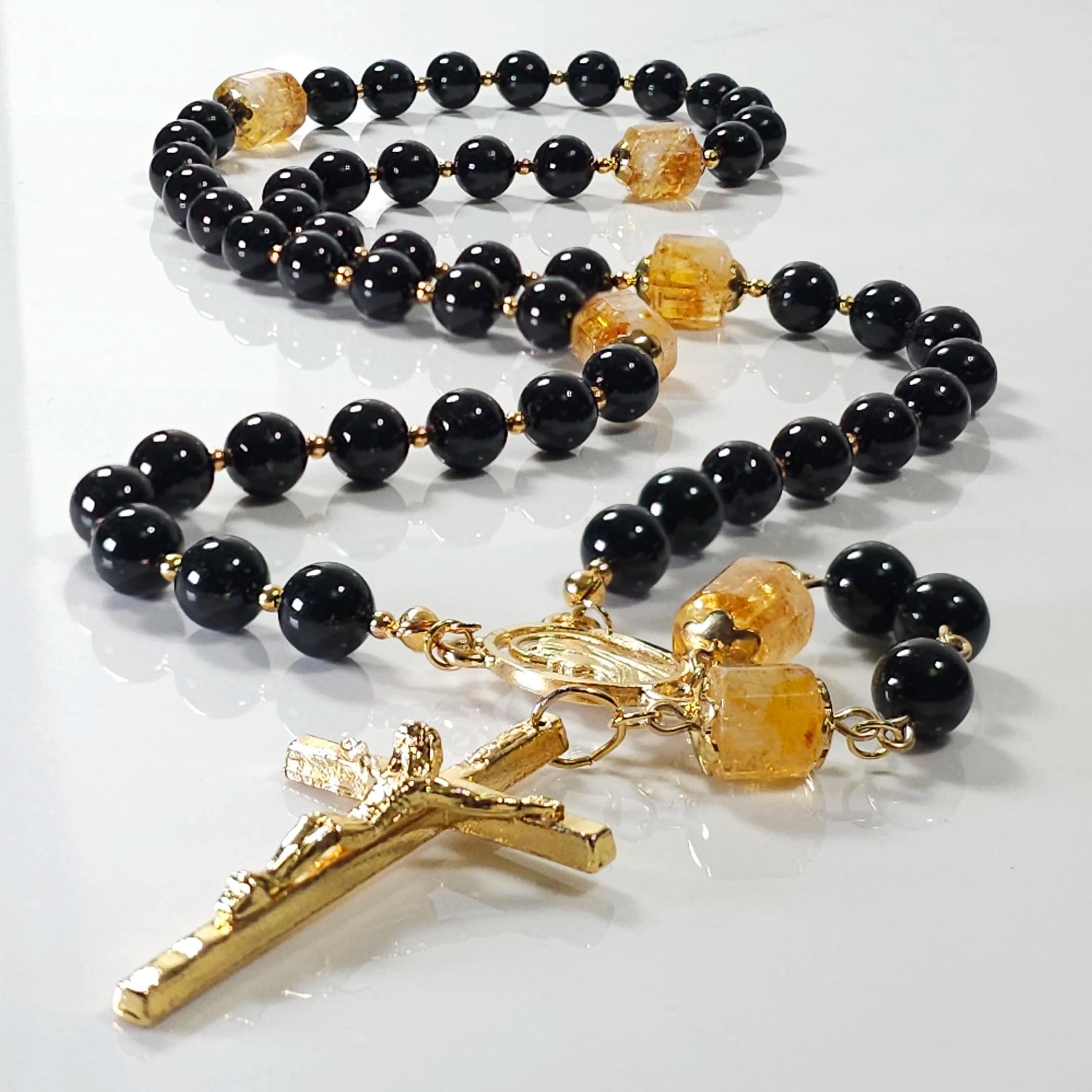 Our lady of Loreto rosary, laying on the table.