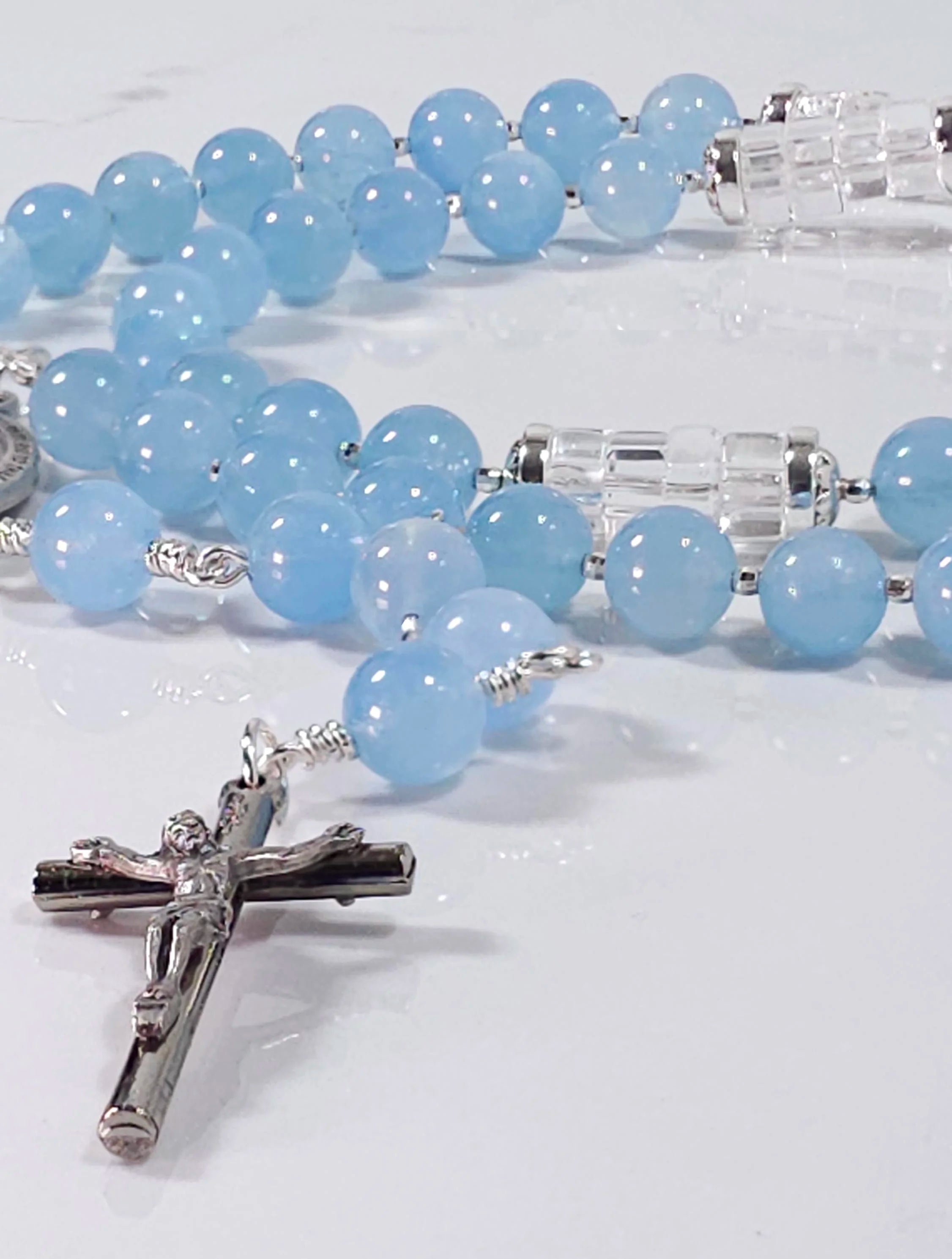 Blue rosary inspired by Marian blue color, made from aquamarine gemstone and sterling silver medal and crucifix.