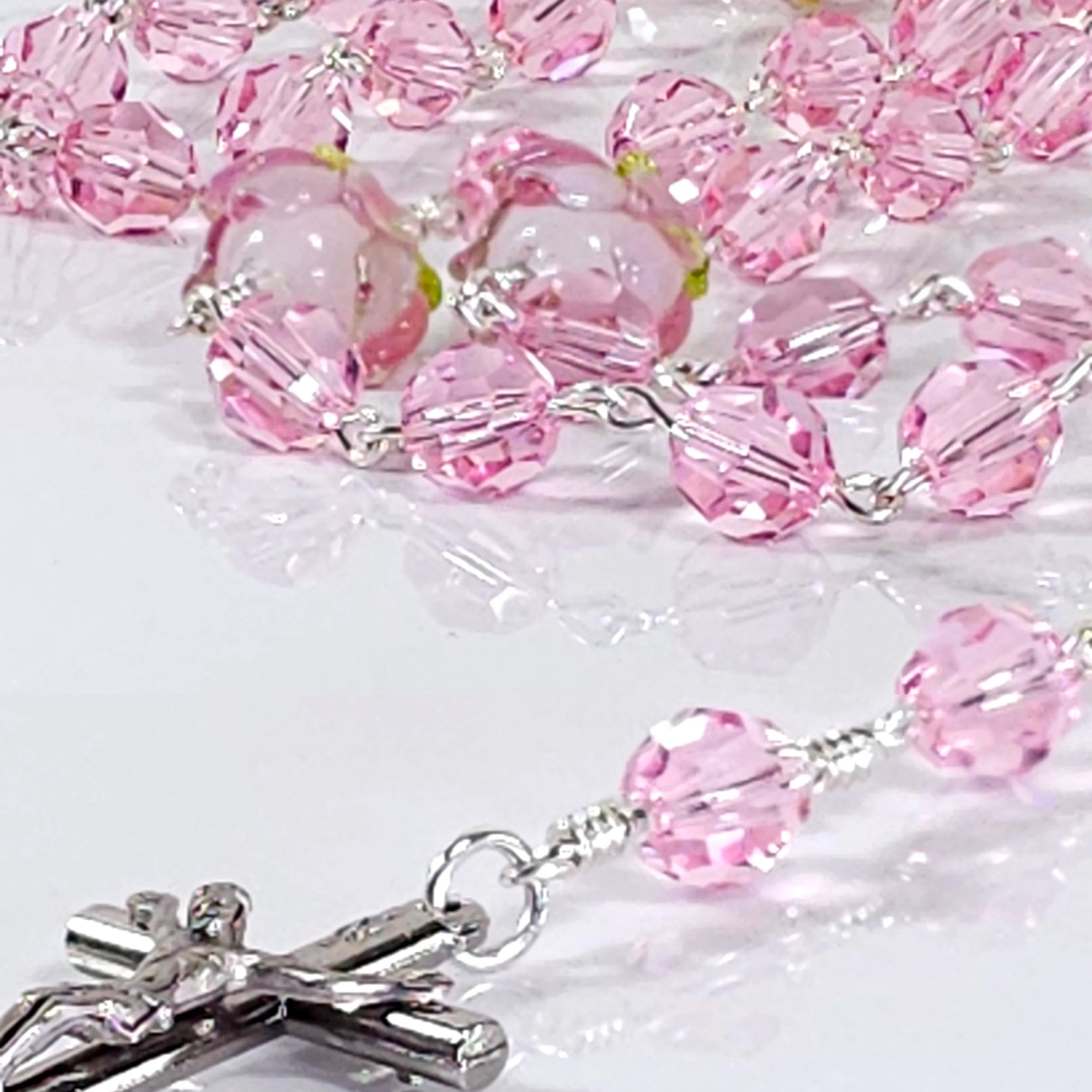 feminine heirloom pink rosary with miraculous medal and sterling silver finding.